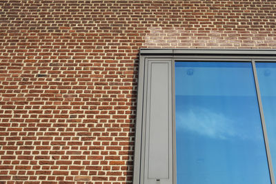 Low angle view of window on wall of building