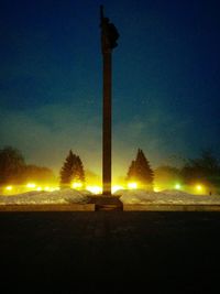 Street light against sky at night