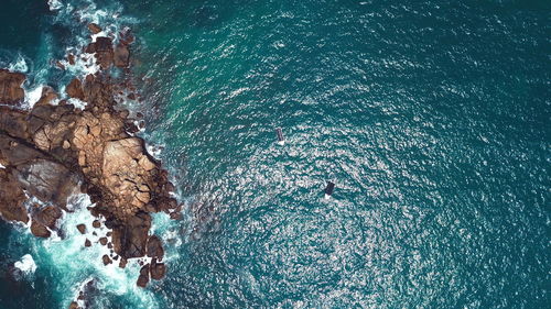 High angle view of rock formation in sea