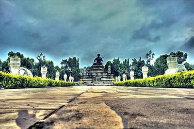 Monument against cloudy sky