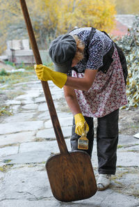 Woman painting on wood