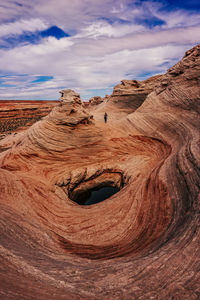 Rock formations on landscape against sky