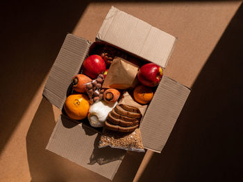 Healthy food delivery harsh shadow. take away products package donation box online shopping delivery