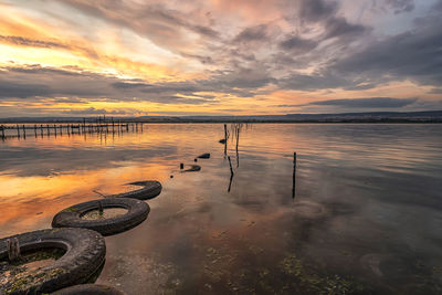 Scenic view of lake against sky during sunset