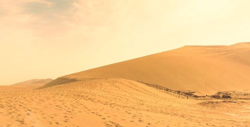 Scenic view of desert against sky