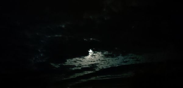 Low angle view of moon in sky at night