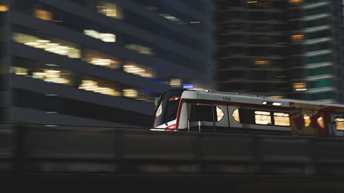 Blurred motion of illuminated building in city at night