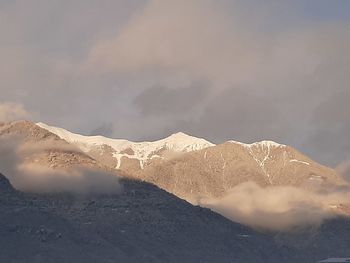 Scenic view of snowcapped mountains against sky