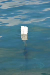 High angle view of wooden post in sea