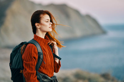 Young woman looking away outdoors