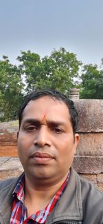 Portrait of man against wall