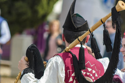 Man wearing costume on street during festival