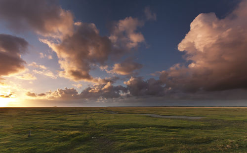 Scenic view of calm sea against cloudy sky