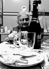 Portrait of woman with drink in restaurant