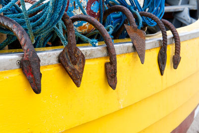 Close-up of rope tied on metal boat