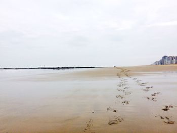 View of beach against cloudy sky