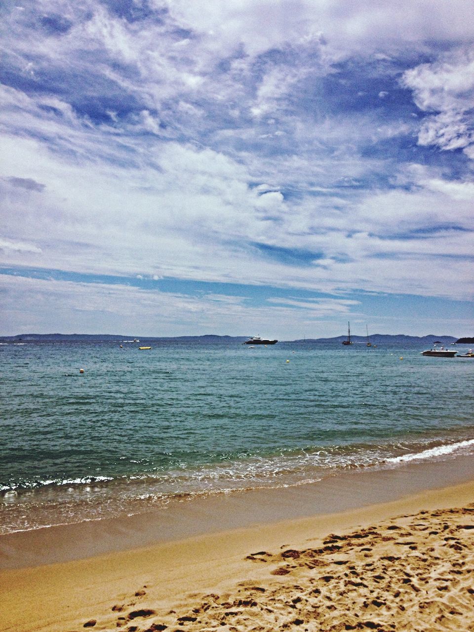 sea, beach, water, horizon over water, sky, shore, sand, tranquil scene, scenics, tranquility, beauty in nature, cloud - sky, wave, nature, coastline, cloudy, cloud, idyllic, surf, outdoors