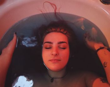 High angle view of woman in bathtub