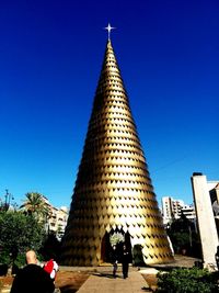 Low angle view of temple against clear blue sky