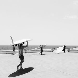 View of sea with people in background