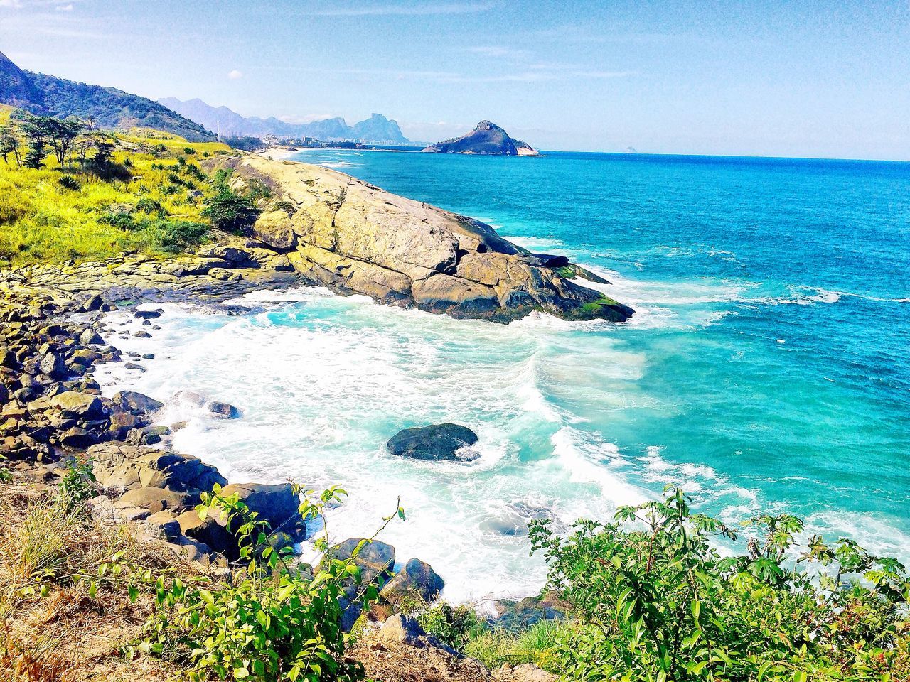 water, sea, beauty in nature, scenics, tranquil scene, horizon over water, tranquility, blue, nature, clear sky, coastline, beach, idyllic, high angle view, cliff, plant, shore, mountain, sky, wave