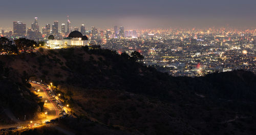 Fourth of july fireworks over griffith observatory with the los angeles skyline in the distance