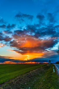 Scenic view of field against sky during sunset