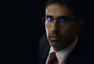 Close-up portrait of a serious young man