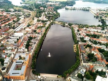 Aerial view of city with houses and lake