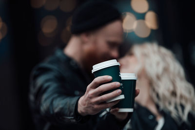 Man holding coffee cup