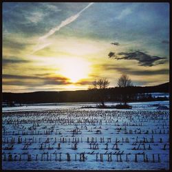 Scenic view of landscape against sky during sunset