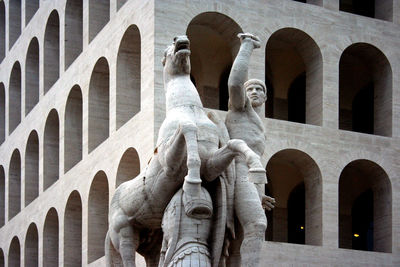 Low angle view of statue against building