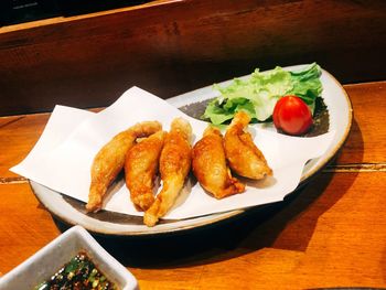 High angle view of fruits in plate on table