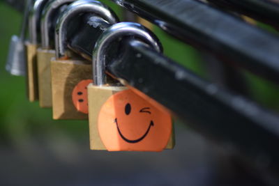 Close-up of padlocks hanging on metal