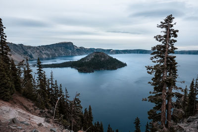 Scenic view of lake and trees against sky