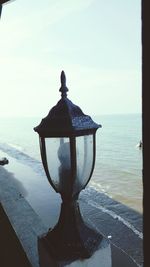 Close-up of gazebo in sea against sky