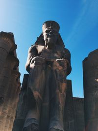 Low angle view of statue against sky