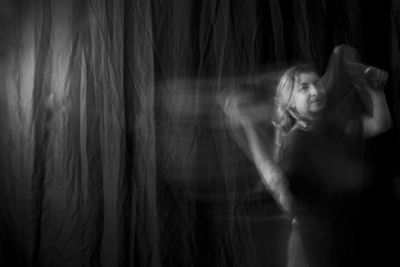 Time lapse view of woman moving a rag. long exposure, motion blur. 