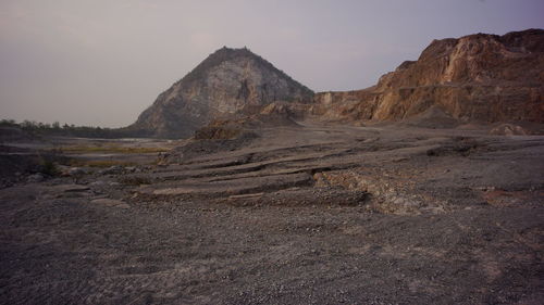 Rock formations in desert against sky