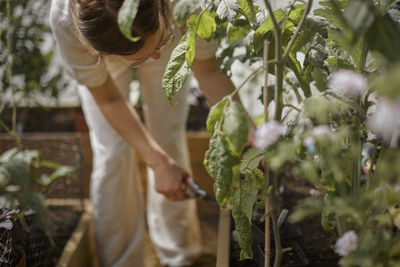 Woman taking care of plants