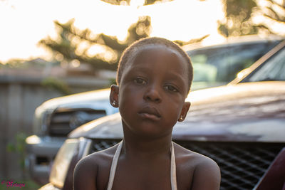 Portrait of young woman in car