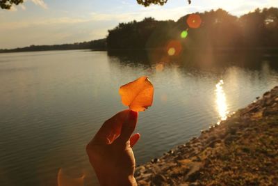 Scenic view of lake at sunset
