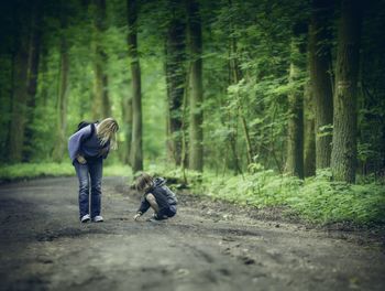 Boy and woman in forest