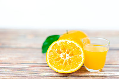 Close-up of orange juice on table