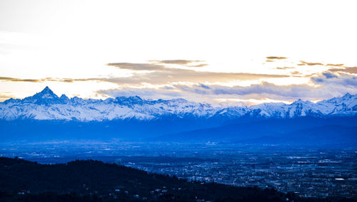 Scenic view of snowcapped mountains against sky