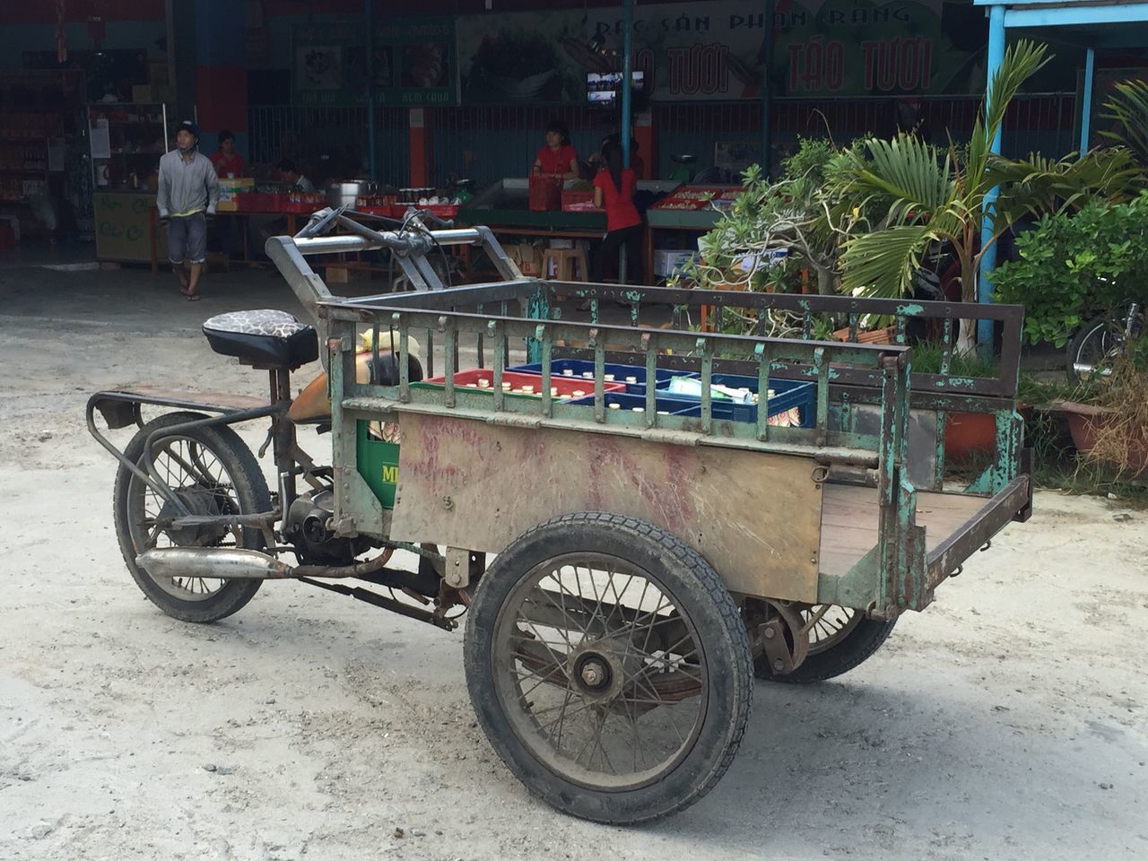 transportation, mode of transport, land vehicle, road, person, retail, stationary, casual clothing, day, footpath, city life, parked