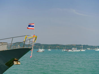 Sailboat on sea against sky