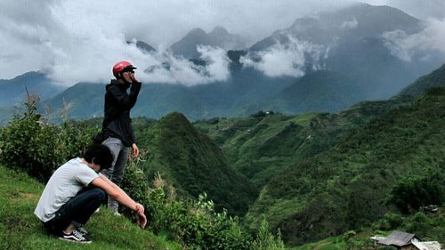 Man standing on mountain peak