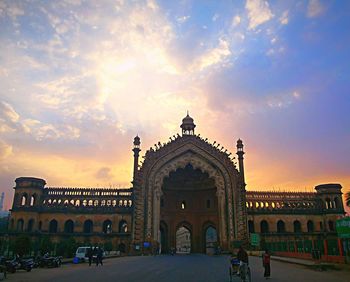 Facade of building against cloudy sky