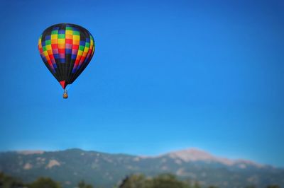 Hot air balloon against clear blue sky